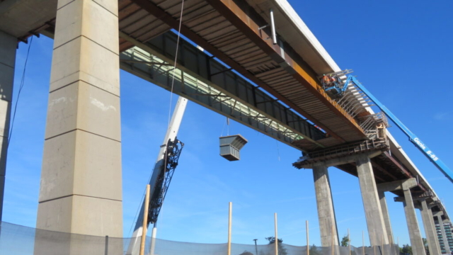 160-ton crane lowering the containment bin