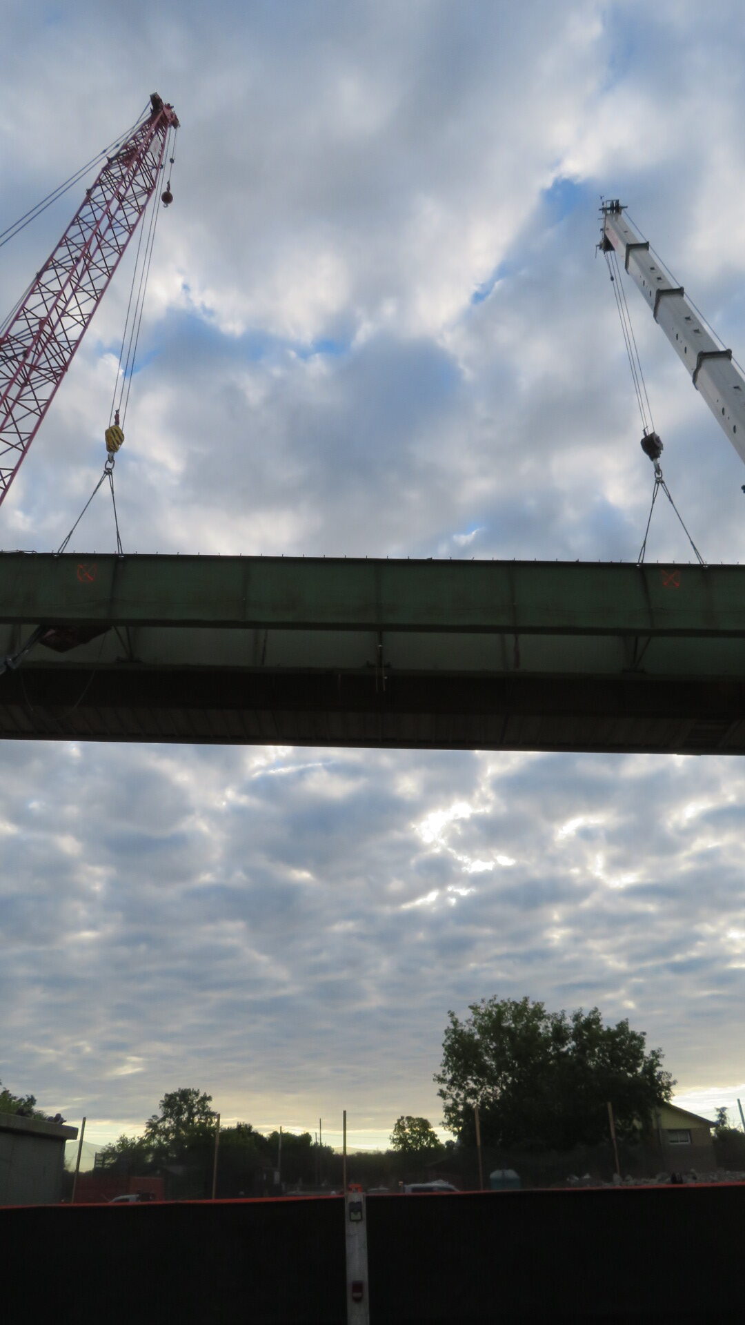 View east, both cranes hooked-up to the girder section