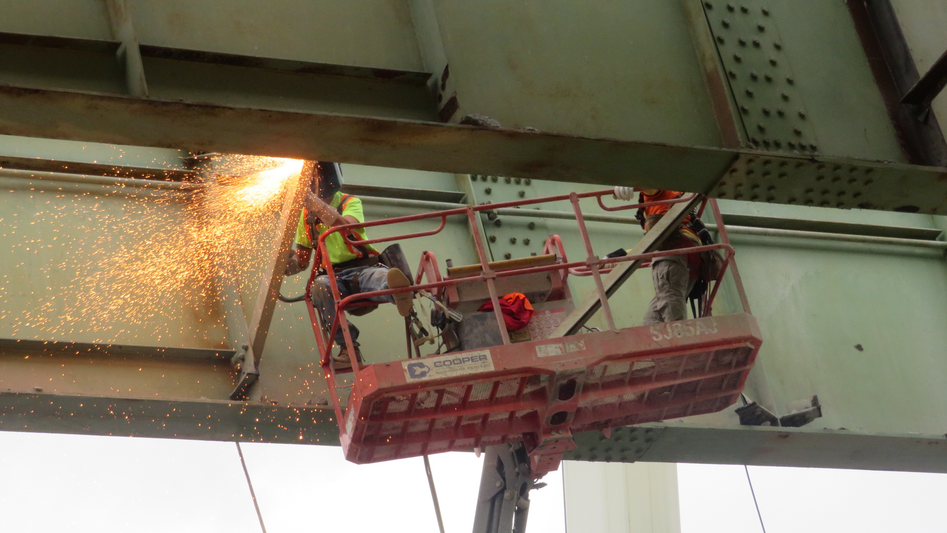 Close-up, torch cutting the bracing for girder removals