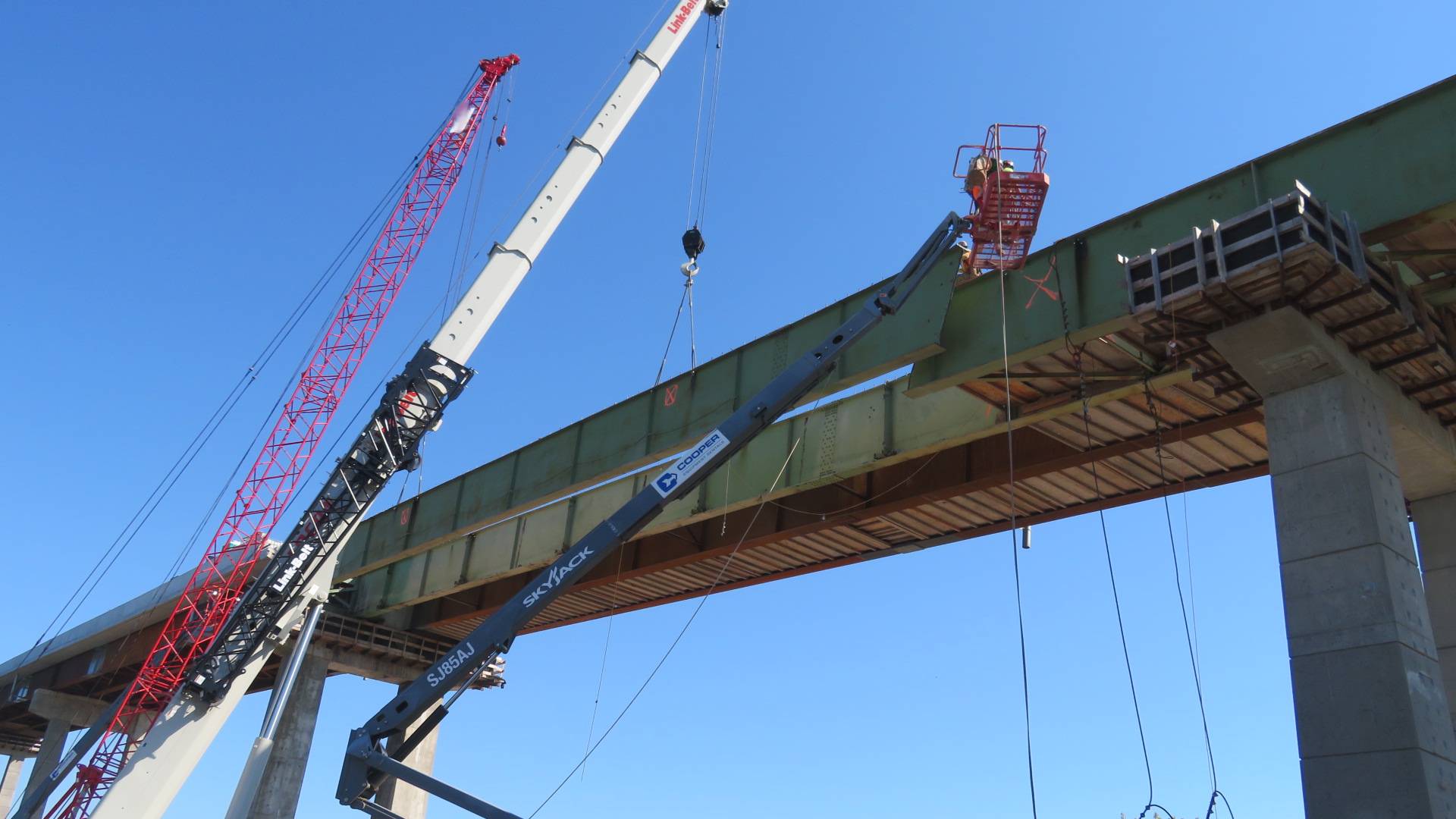 Moving the girder section into place to be lowered