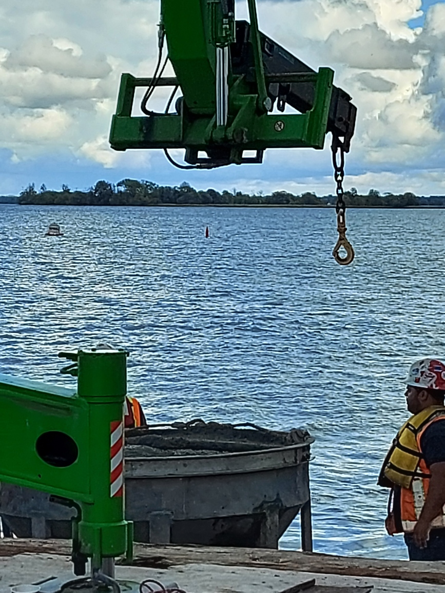 Preparing to remove the concrete hopper from the boat