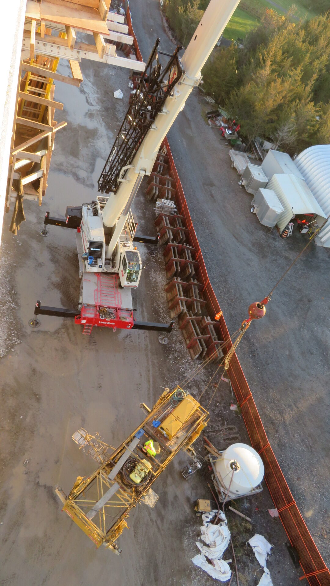 160-ton crane lowering the concrete finisher to the ground