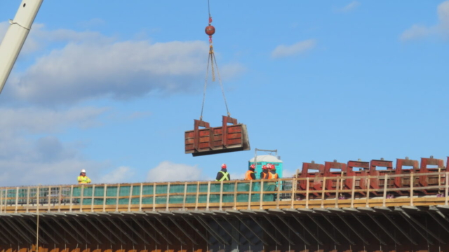 160-ton crane lowering the barrier wall formwork