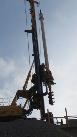 Auger attached to the drill