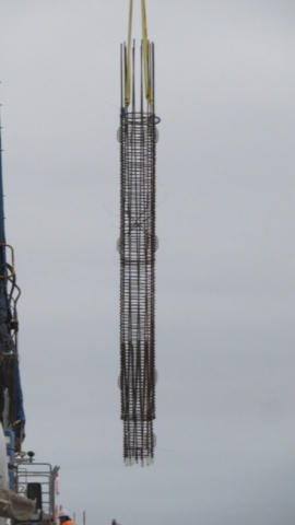 Close-up, caisson liner cage being lifted