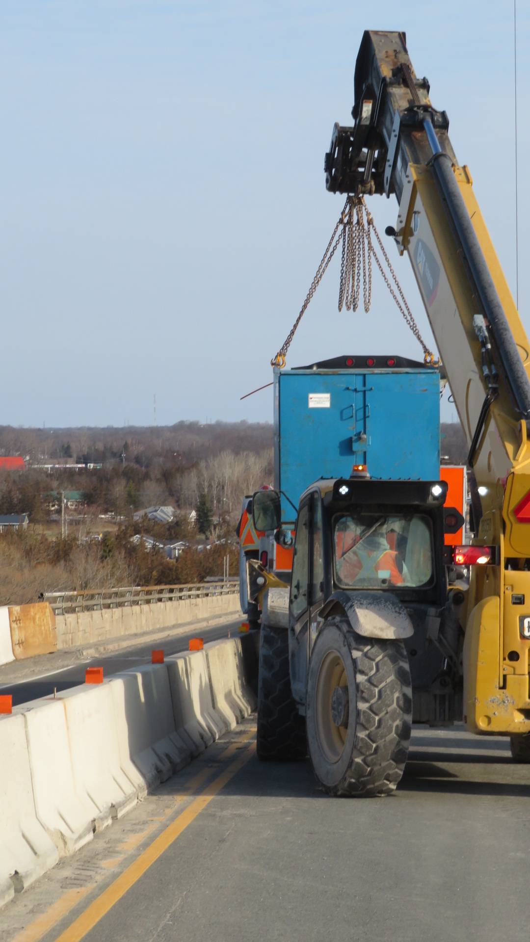Telehandler moving the tool cabinet to the bridge deck