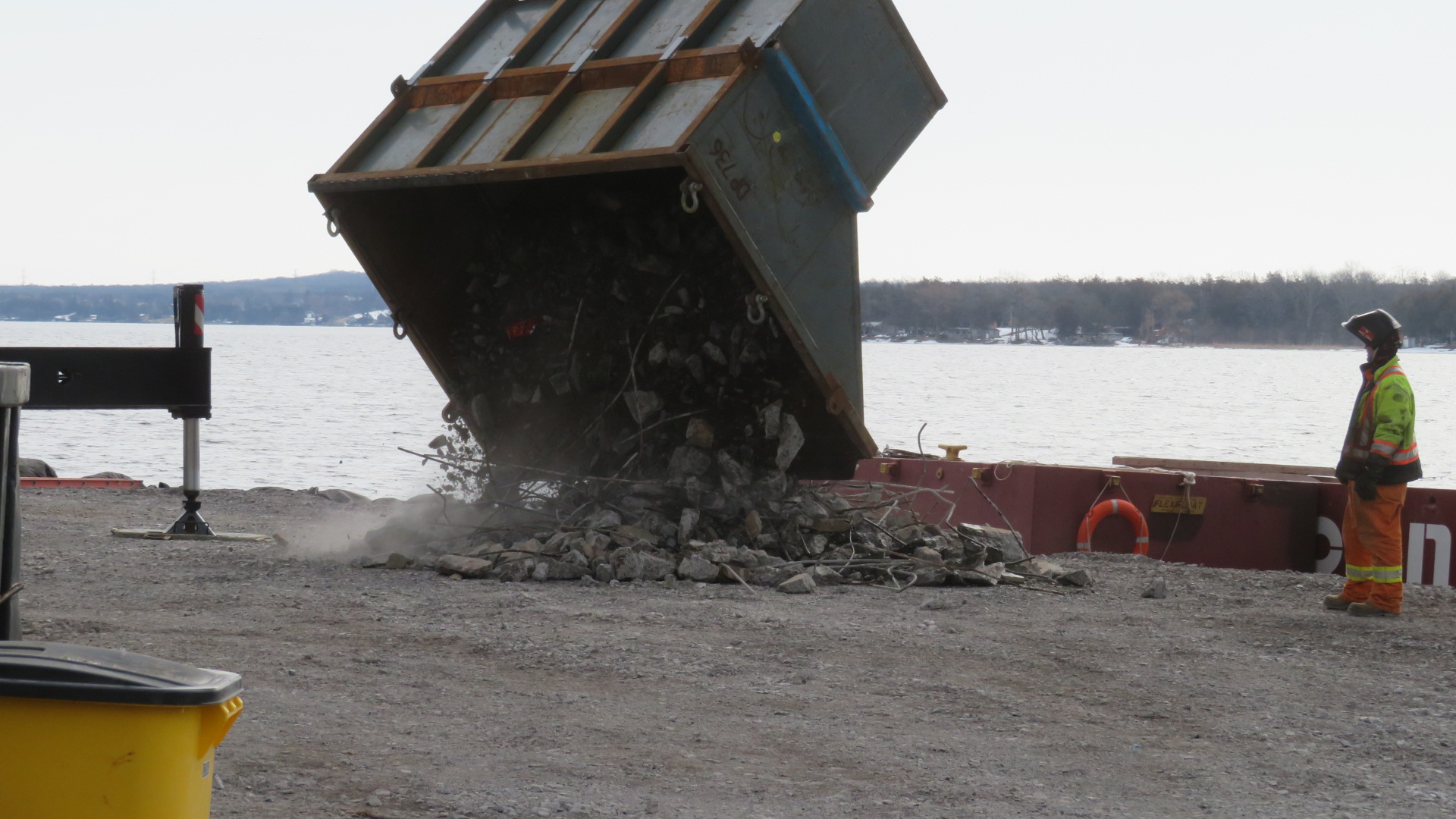 Removing concrete debris from the containment bin