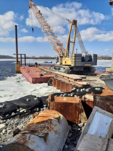 Loading the 200-ton crane onto the barge
