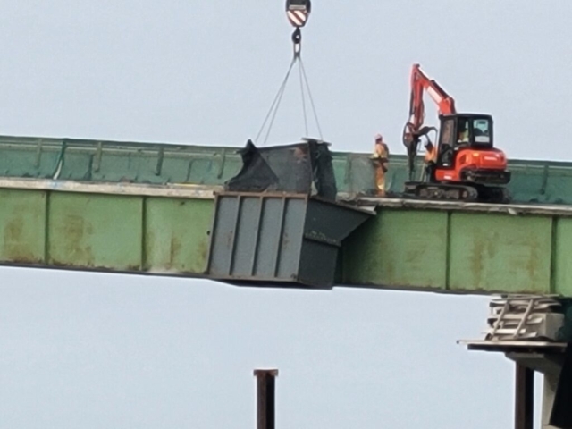Hoe-ramming the remainder of the bridge deck