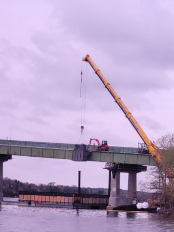 360-ton crane lifting the containment bin, hoe-ram