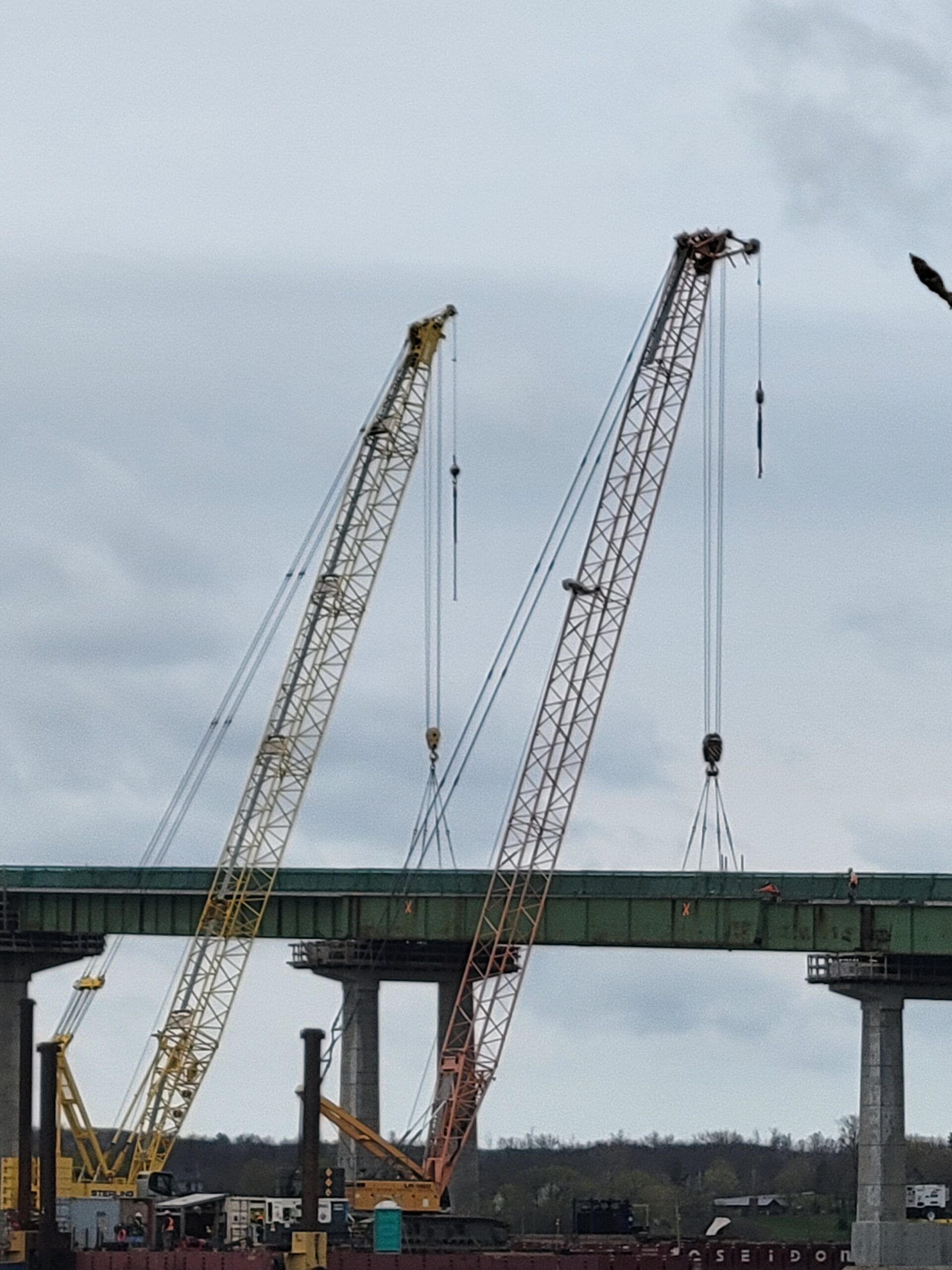 Both 200-ton cranes hooked-up to the third girder section for removal