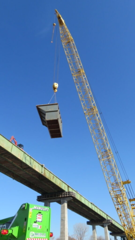 200-ton crane removing the full bin