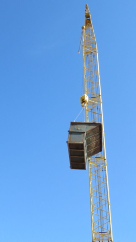 200-ton crane lowering the containment bin into place