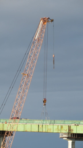 200-ton crane tightening the rigging on the girder