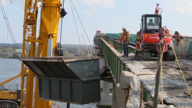 360-ton crane moving the containment bin to the deck
