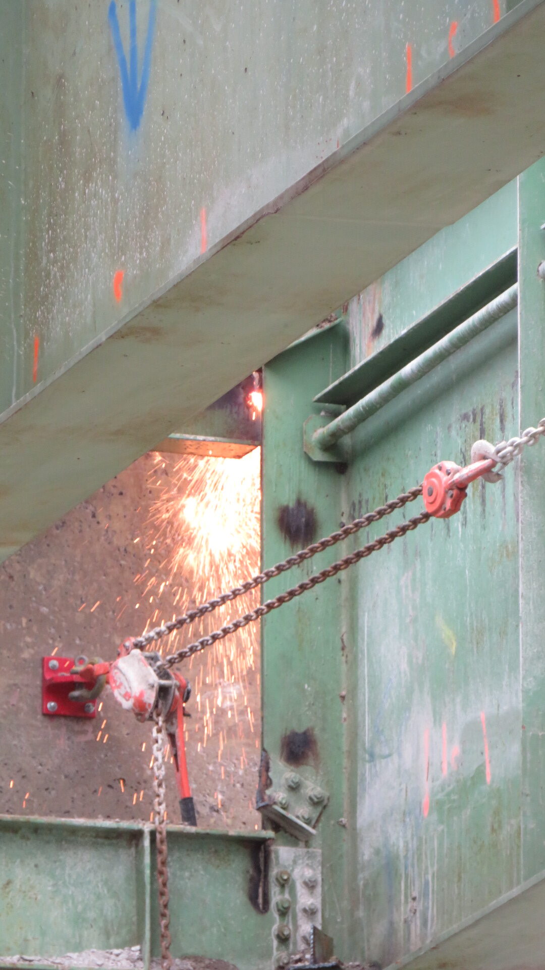 Torch cutting the girder at the north abutment