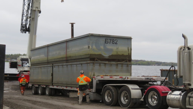 Removing the containment barges from site