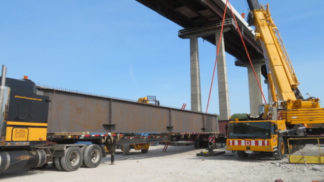 200-ton crane, removing girders from the truck to the barge