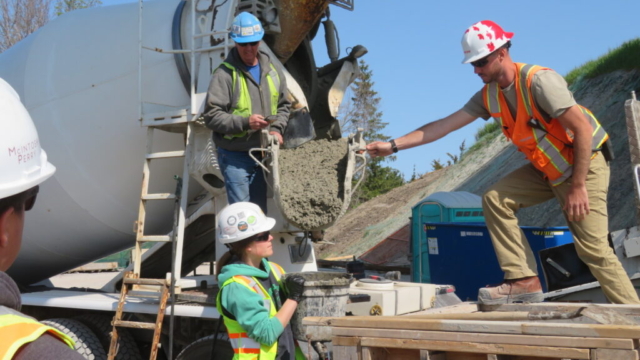 Placing the concrete into the bucket for testing