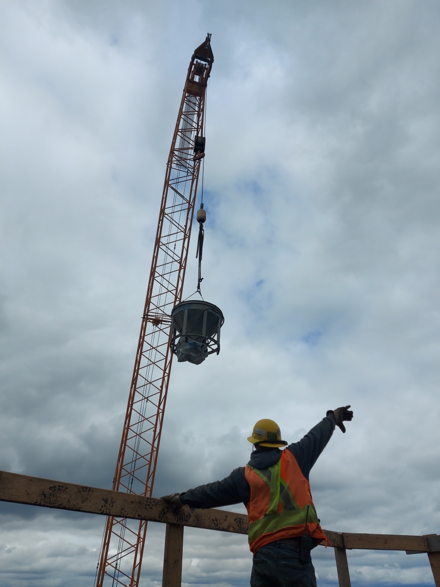 200-ton crane lifting the concrete hopper o the pier cap