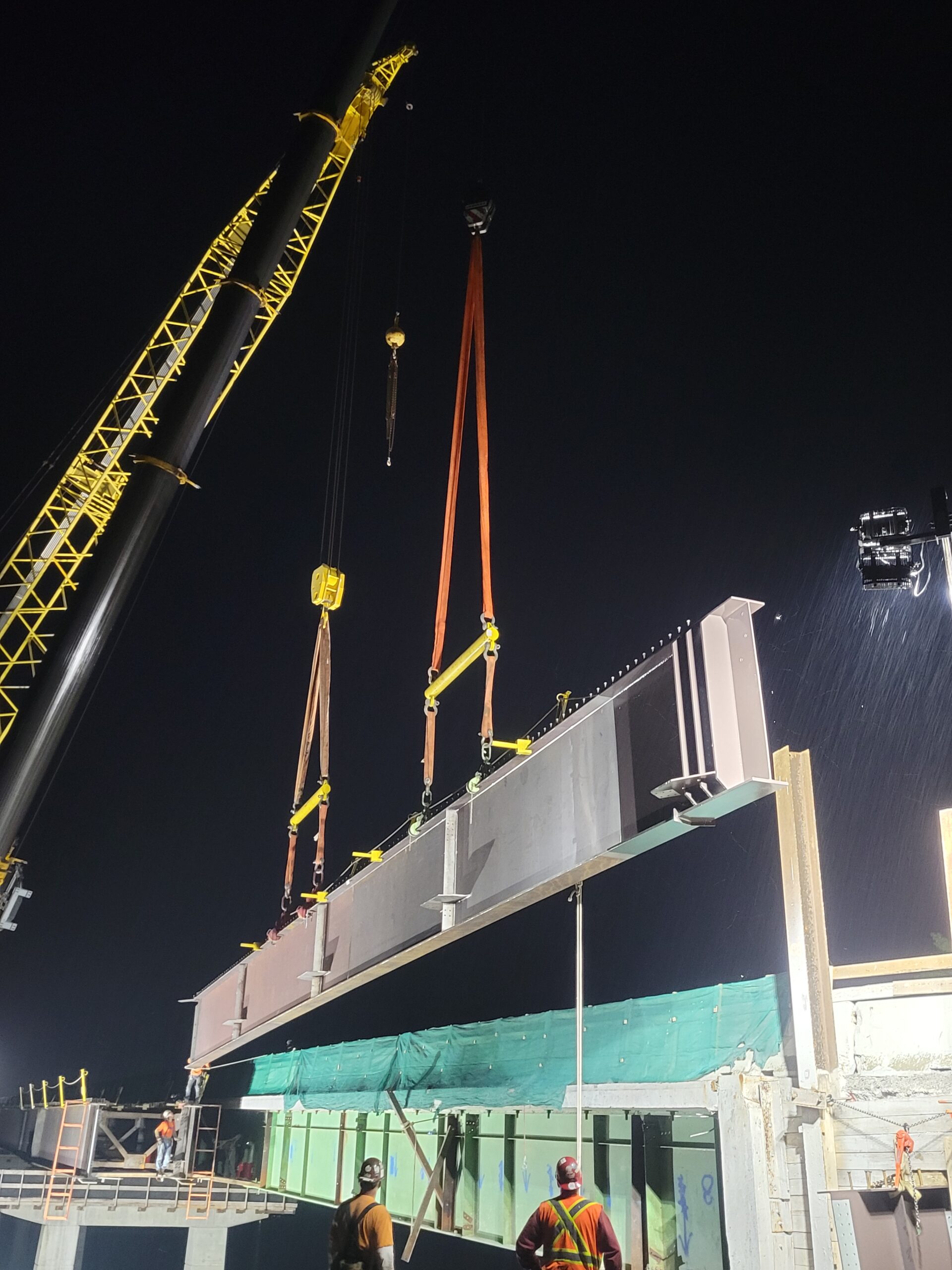 Both 200-ton cranes lowering the girders to the piers