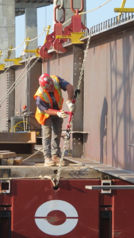 Releasing the restraints on the girder