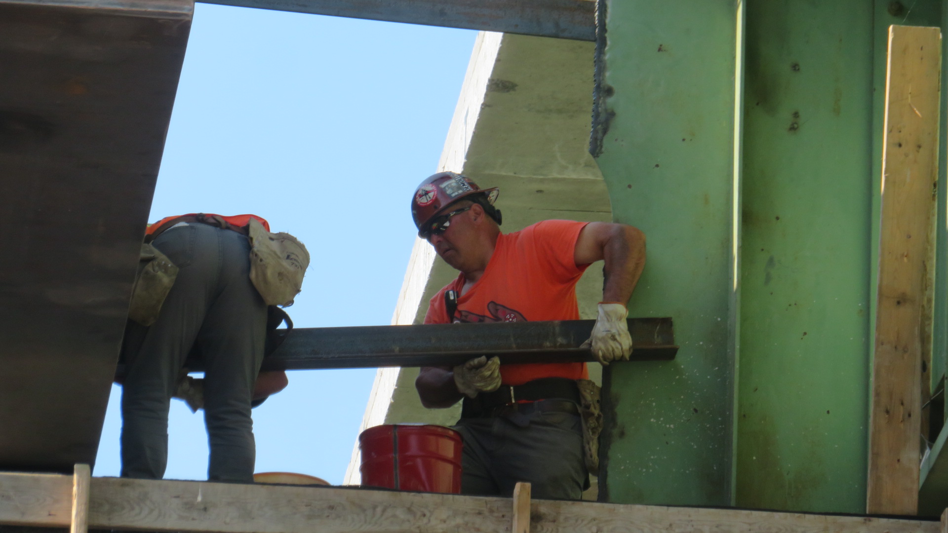 Installing the bracing between the new and existing girders
