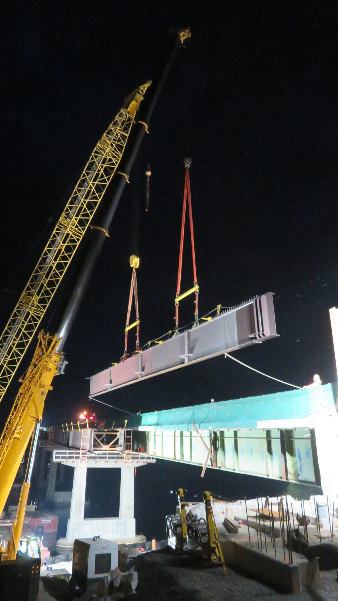 Lowering the first girder