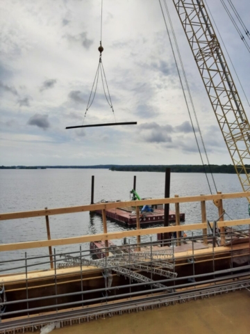 200-ton crane lifting materials to the bridge deck