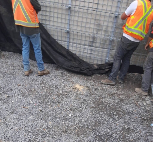 Installing geotextile at the north abutment