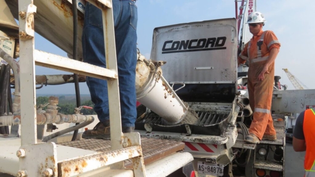 Placing concrete into the concrete pump truck