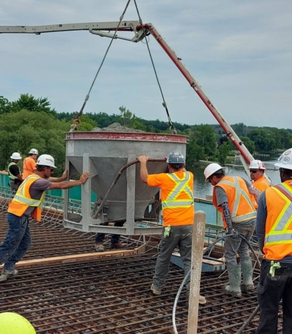Using the hopper to place a section of the concrete deck