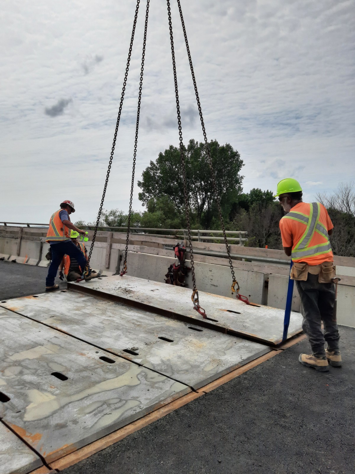 Lowering the temporary reinforced deck panels